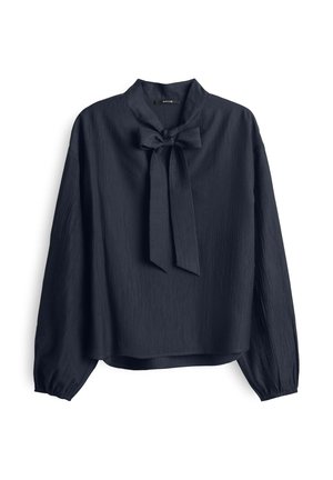Blusa blu navy con fiocco al collo, maniche lunghe e tessuto testurizzato. Vestibilità ampia con orlo arrotondato. Aspetto setoso.
