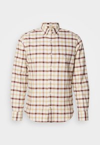 Camicia a maniche lunghe a quadri nei colori crema, marrone e beige, con colletto a punta e taschino con ricamo del logo. Materiale in cotone.