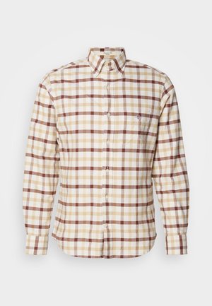 Košeľa s dlhými rukávmi na zapínanie na gombíky, zdobená károvaným vzorom v béžovej, hnedej a krémovej farbe, s klasickým golierom a predným vreckom.