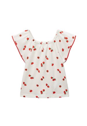 Haut blanc à manches courtes avec un col froncé, présentant un motif de tomates rouges et un galon rouge festonné autour des manches et de l'ourlet.