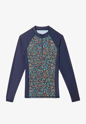 Langærmet rashguard med lynlåslukning ved halsen, mørkeblå ærmer og et blomstermønster i rød, orange, blå og grøn på torsoen.