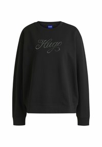 Felpa nera realizzata in morbido tessuto, con colletto rotondo e maniche lunghe. La scritta "Hug" è ricamata in strass sul davanti.