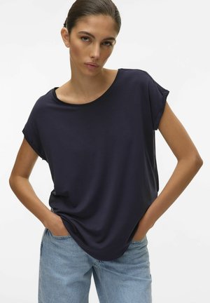Navy blue short-sleeve top with a relaxed fit and wide neckline, made from soft material, paired with light blue loose-fitting jeans.