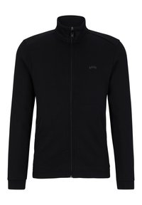 Svart zip-up jacka med hög krage, ribbade ärmslut, sidofickor med dragkedja och en diskret logotypdetalj på bröstet. Mjuk tygtextur.