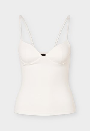 Hvid figursyet ærmeløs camisole-top med tynde, justerbare spaghetti-stropper og en let sweetheart-udskæring.