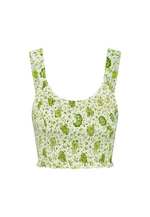 Smocked crop top in white fabric with green floral pattern. Features wide straps and a gathered texture throughout.