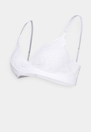 Sutiã bralette branco de renda com alças de cetim ajustáveis, apresentando um padrão floral e uma faixa branca sólida na parte inferior. Textura suave e forma triangular.