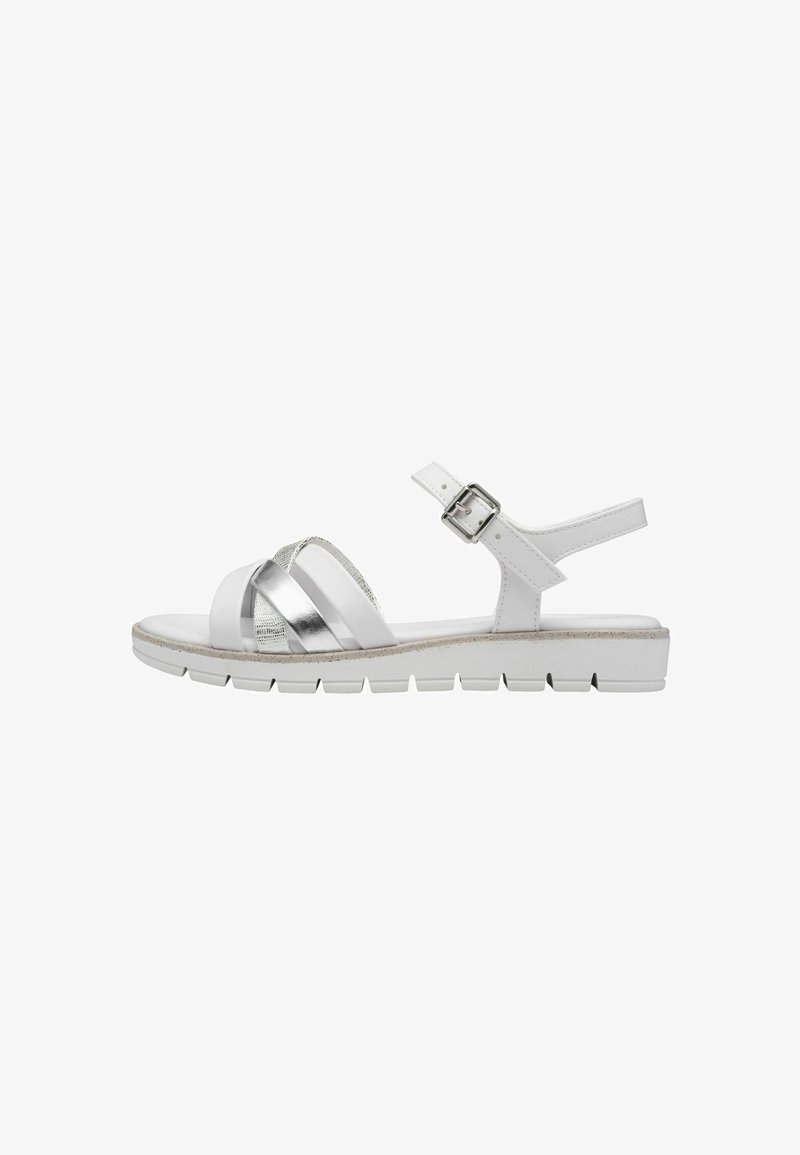 White sandal with metallic silver straps, adjustable ankle buckle, and a lightweight, textured sole. Open-toe design for breathability.