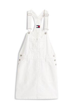 Λευκό φόρεμα με τιράντες που διασταυρώνονται πίσω και είναι ρυθμιζόμενες, μπροστινή τσέπη στο στήθος, λεπτομέρειες με κουμπιά στα πλάγια και κηλίδα με το λογότυπο Tommy Jeans.