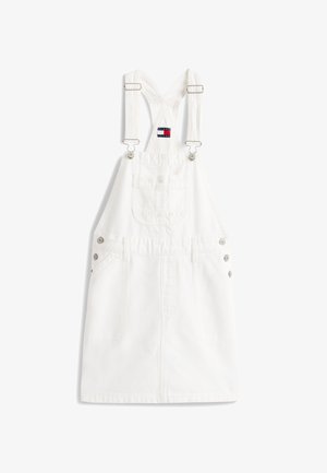Λευκό φόρεμα με τιράντες που διασταυρώνονται πίσω και είναι ρυθμιζόμενες, μπροστινή τσέπη στο στήθος, λεπτομέρειες με κουμπιά στα πλάγια και κηλίδα με το λογότυπο Tommy Jeans.