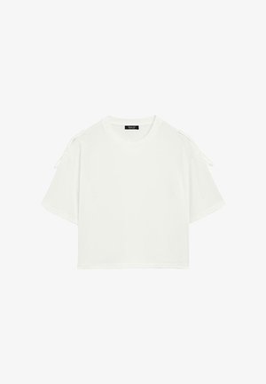Vit kortärmad t-shirt i bomull med rund halsringning, korta ärmar med justerbara knytband på axlarna och en avslappnad passform.
