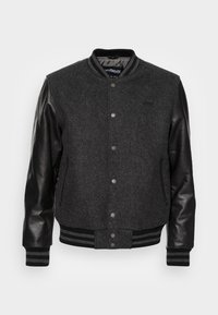 Gray wool-blend varsity jacket with black leather sleeves, snap button closure, ribbed cuffs and hem, and side pockets.