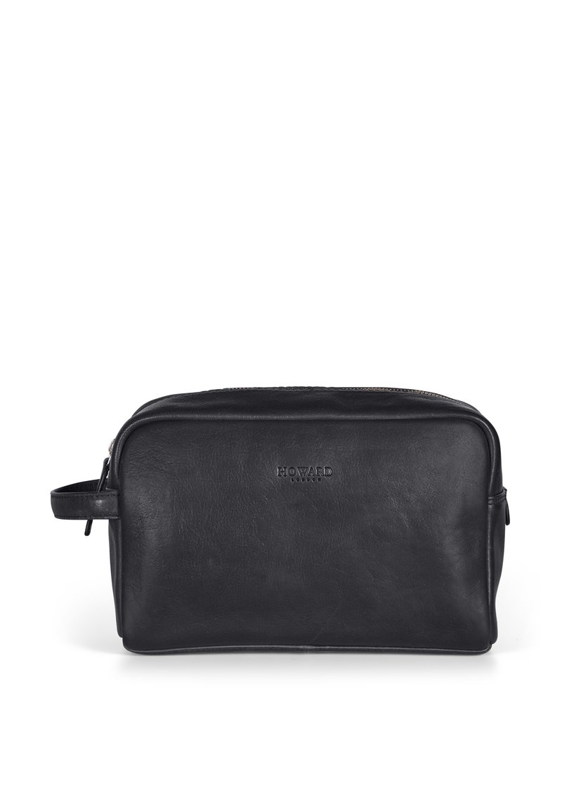 Svart läder toalettväska med slät textur och rektangulär form. Har en dragkedjestängning och ett sidhandtag för enkel transport.
