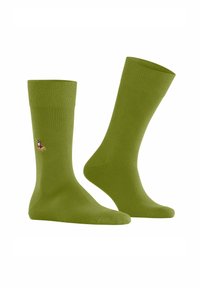 Grüne Baumwollsocken mit einem gerippten Bündchen. Merkmale ein kleines besticktes Design eines Entenmotivs an der Seite. Weicher Stoff, Standardlänge.