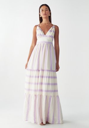 Maxi dress with a V-neck, featuring lavender and cream stripes, textured fabric, and layered ruffles at the hem. Adjustable shoulder straps.