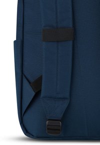 Navy backpack featuring durable fabric, adjustable black straps, and a side pocket with a rectangular shape and flat bottom.