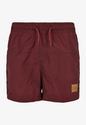 Pantaloni da bagno bordeaux realizzati in materiale leggero con cintura elastica, cordoncino e una piccola etichetta in pelle con la dicitura "URBAN CLASSICS."