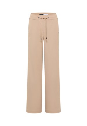 Pantalons larges beiges en tissu doux, avec une taille élastique dotée d'un cordon de serrage et des poches latérales. Texture lisse et sans motifs.