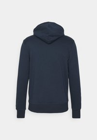 Sudadera azul marino hecha de una mezcla de algodón, con capucha ajustable, mangas largas y puños y dobladillo acanalados. Textura suave, diseño sencillo.