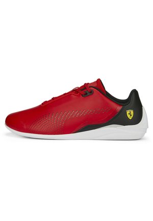 Red synthetic shoes with black accents, a sleek, aerodynamic shape, perforated design for ventilation, and a white sole featuring a logo.