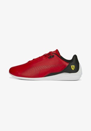 Red synthetic shoes with black accents, a sleek, aerodynamic shape, perforated design for ventilation, and a white sole featuring a logo.