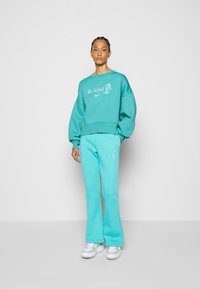 Nike Sportswear TREND CREW OVERSIZED - Camisola - washed teal