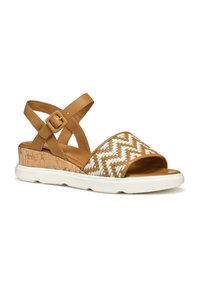 Sandal in pelle marrone con motivo intrecciato bianco, dotato di tacco a zeppa in sughero e suola in gomma bianca. Cinghie incrociate regolabili per una vestibilità perfetta.