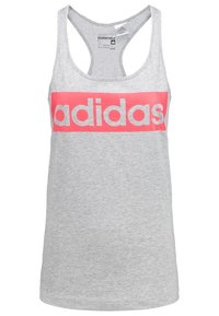 Šedý top na ramínka vyrobený z měkké látky s designem racerback. Na hrudi se nachází výrazné růžové logo "adidas". Velikost S.