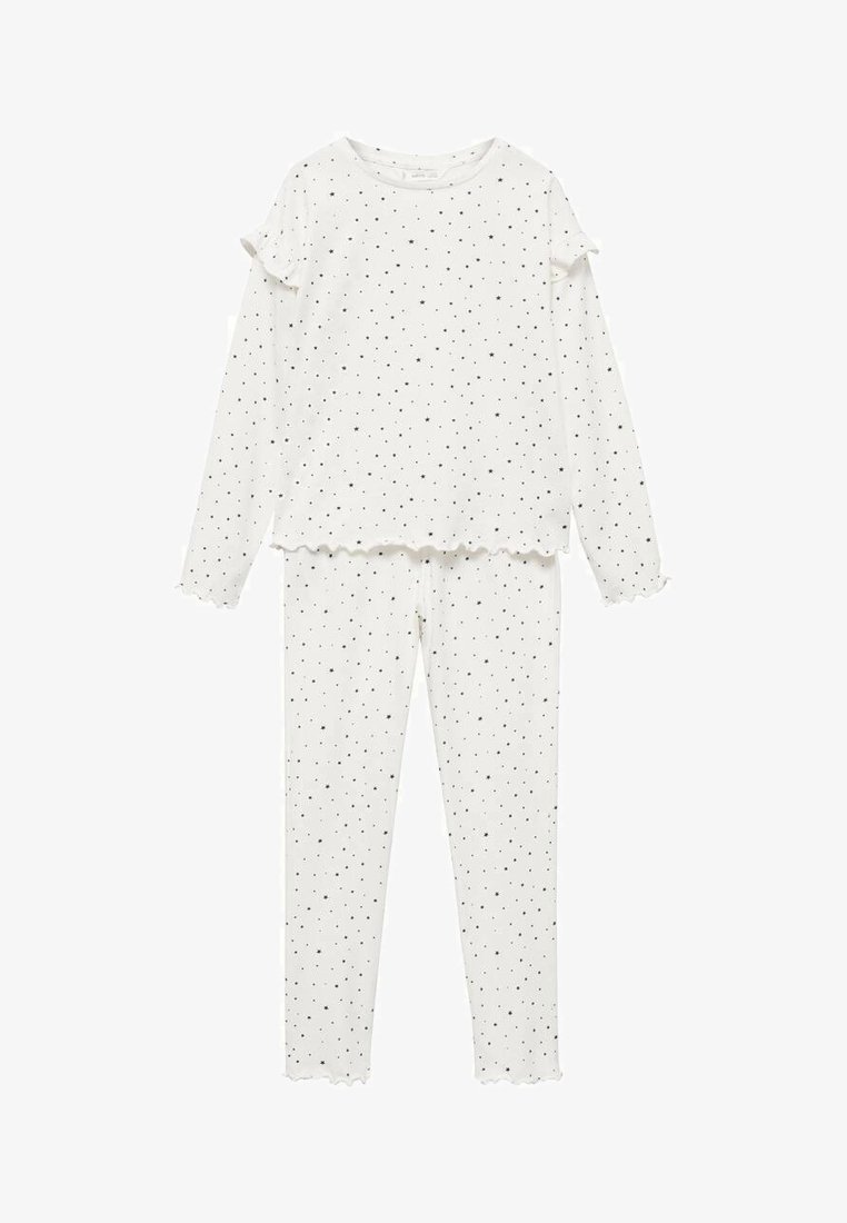Valkoinen pyjama-asusetti mustalla tähtikuviolla. Pitkähihainen toppi, jossa on röyhelöhihat ja aaltoilevat reunat; yhteensopivat istuvat housut samankaltaisilla yksityiskohdilla.