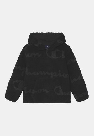 Hoodie noir en polaire texturée et douce au toucher. Il dispose d'une grande poche et d'une capuche. Logo "Champion" discrètement en relief en gris.