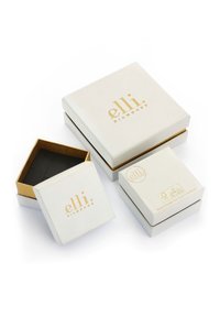 Weiße Schmuckschachteln mit goldenen Akzenten und dem "elli Diamonds"-Logo. Zwei Größen: eine quadratische und eine kleinere mit schwarzem Innenraum zur Aufbewahrung.