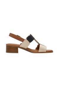 Sandalette mit niedrigem Blockabsatz, brauner Sohle, beigen und schwarzen Lederriemen sowie verstellbarem braunem Knöchelriemen.