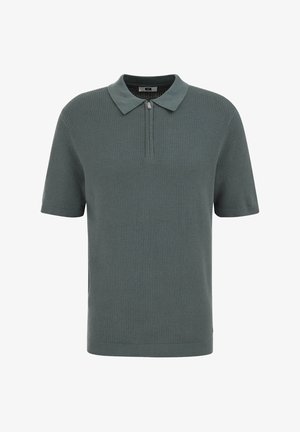 Polo a maniche corte in maglia strutturata colore verde tenue con collo a risvolto e zip corta sul davanti.