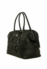 Sac à langer noir en nylon matelassé avec deux poignées noires, mettant en avant un texte audacieux "SAC À LANGER" et une fermeture éclair sur le côté.