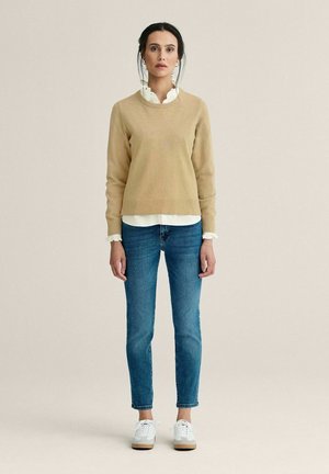 Stickad tröja - beige