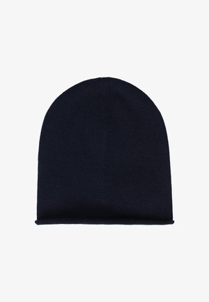 Tumedast meresinise värvi koonus kõikuv keepe müts pehme, tekstuurse kangaga. Omab ümarat krooni jaaluseks märgistusega äärist.