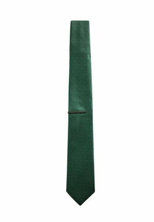 Dark green textured necktie with a small repeating diagonal pattern and a dark tie bar near the middle.