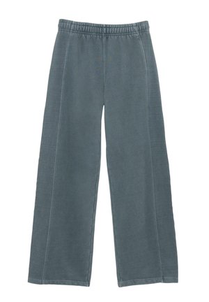 Pantaloni larghi grigi realizzati in tessuto morbido, caratterizzati da una vita elastica e dettagli di cucitura visibili lungo i lati.