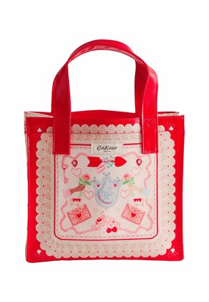 Punane ja kreemjas kandekott südame- ja lillemustritega, pitsdetailidega ning esitaskul märgisega "Cath Kidston London".