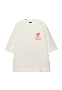 Cream T-shirt with short sleeves, crew neck, and a red circular graphic and text "Alternative Culture" on the left chest area. Soft texture.
