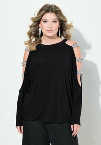 Schwarzes Oberteil mit Ausschnitt-Design an den Schultern, verziert mit silbernen Strassakzenten und langen Ärmeln, aus weichem, schmeichelndem Stoff für eine lockere Passform.