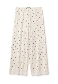 Světlé béžové kalhoty s květinovým vzorem obsahujícím malé červené a zelené motivy, doplněné bílou krajkou na spodním lemu. Elastický pas.