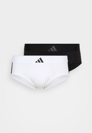 Melnbaltas vīriešu apakšveļa ar gludu tekstūru. Iezīmējas ar kontrastējošām elastīgām jostām ar Adidas logo un pieguļošu dizainu.
