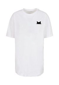 White cotton t-shirt featuring a black cat face graphic on the left chest. Short sleeves and a relaxed fit. Soft texture.
