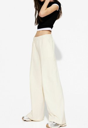 WIDE FUZZY  - Pantaloni de trening - beige