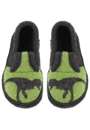 Wollschlappen mit einer schwarzen Dinosaurier-Silhouette auf der leuchtend grünen Vorderseite. Das Design umfasst einen grauen Filzkörper und elastische Seitenpaneele.