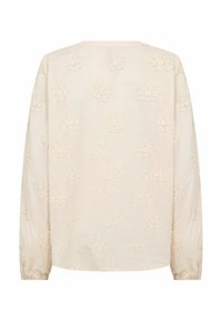 Világos bézs hosszú ujjú blúz virágos hímzéssel, kerek nyakkivágással és ráncolt mandzsettákkal, texturált anyagból.