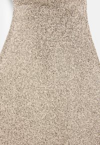 Textured fabric in beige with a fine, woven pattern. Material appears soft and slightly raised, creating a tactile surface.