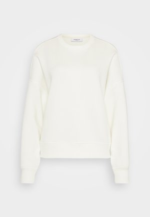 Kreklu džemperis off-white krāsā, izgatavots no mīkstas kokvilnas maisījuma. Iezīmē garas piedurknes, brīvu siluetu un ribota apakšmala un piedurknes.
