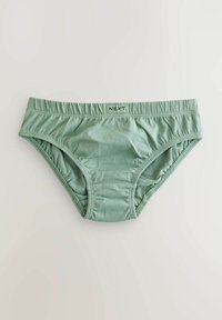 Slips in cotone verdi con elastico in vita, caratterizzati da lati arricciati e una superficie liscia. L'etichetta sulla vita riporta la scritta "NEXT".